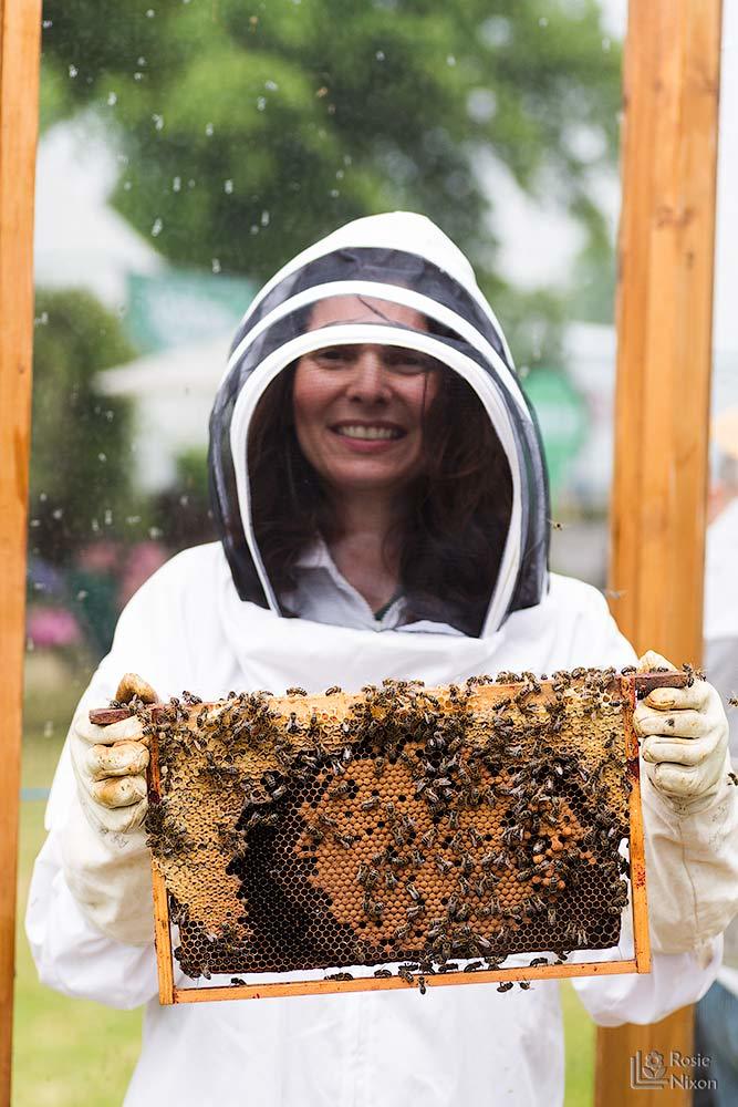 Rosie nixon flower photographer with bee hive frame - bee happy ayr beekeepers gardening scotland